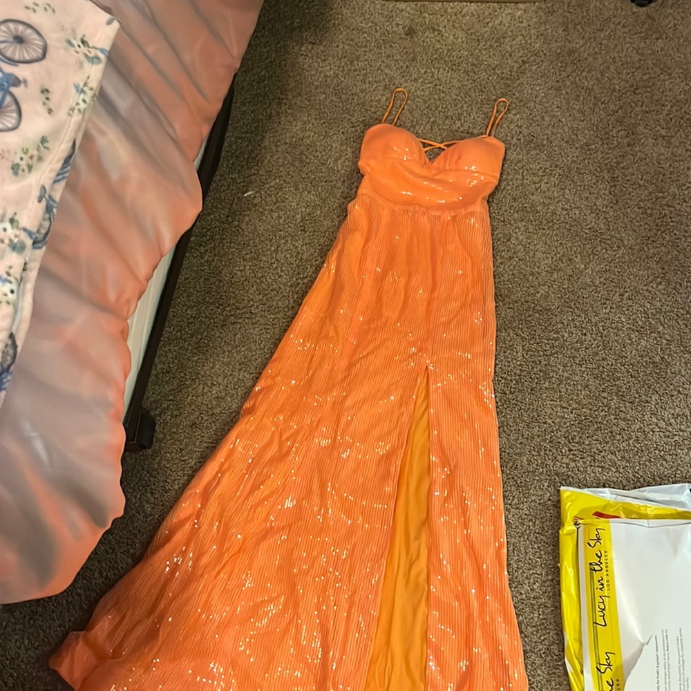 bright orange open back prom dress